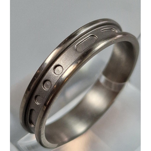 225 - Modernist design Titanium Morse Code ring. Size T1/2. (B.P. 21% + VAT)