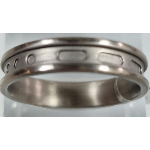 225 - Modernist design Titanium Morse Code ring. Size T1/2. (B.P. 21% + VAT)