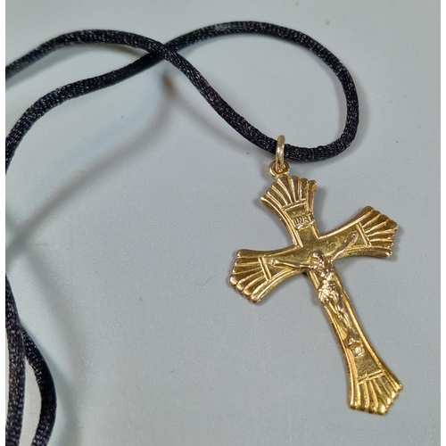 237 - Gilt sterling silver crucifix pendant on black silk chain.  (B.P. 21% + VAT)