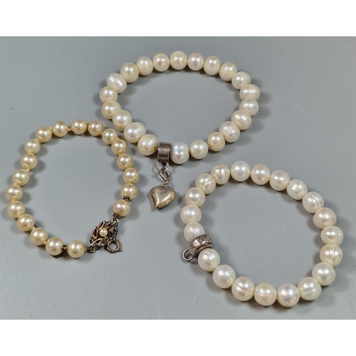 239 - Collection of pearl and faux pearl bracelets, one marked Thomas Sabo Charm Club with silver clasp, t... 