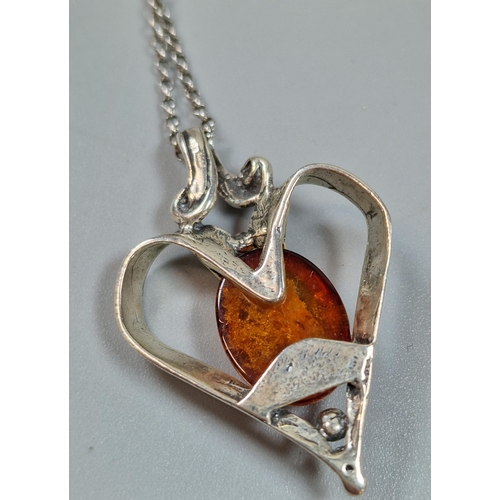 241 - Silver chain with amber and heart shaped silver pendant. (B.P. 21% + VAT)