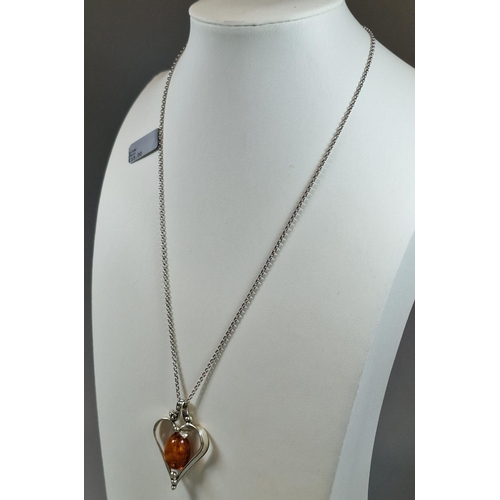 241 - Silver chain with amber and heart shaped silver pendant. (B.P. 21% + VAT)