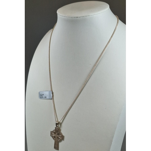 243 - Celtic design silver cross pendant with silver chain.  (B.P. 21% + VAT)