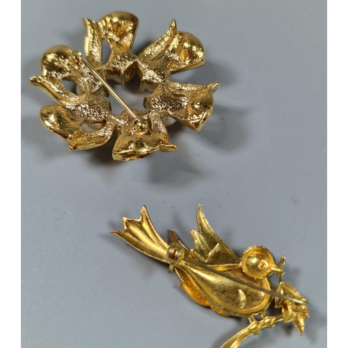 249 - Yellow metal brooch in the form of a bird together with another gold finish floral and pearl design ... 