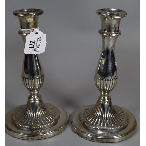 271 - Pair of 19th century silver baluster fluted candlesticks. Rubbed hallmarks for Sheffield. Loaded bas... 