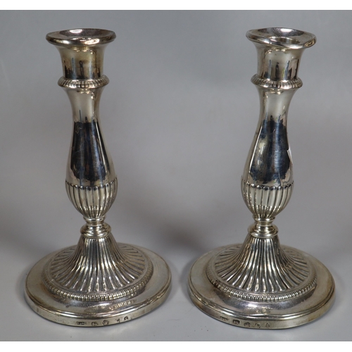 271 - Pair of 19th century silver baluster fluted candlesticks. Rubbed hallmarks for Sheffield. Loaded bas... 