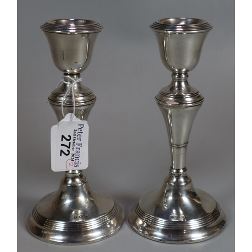 272 - Pair of George V silver baluster candlesticks. Birmingham hallmarks 1921. Loaded bases. 16.5cm high ... 