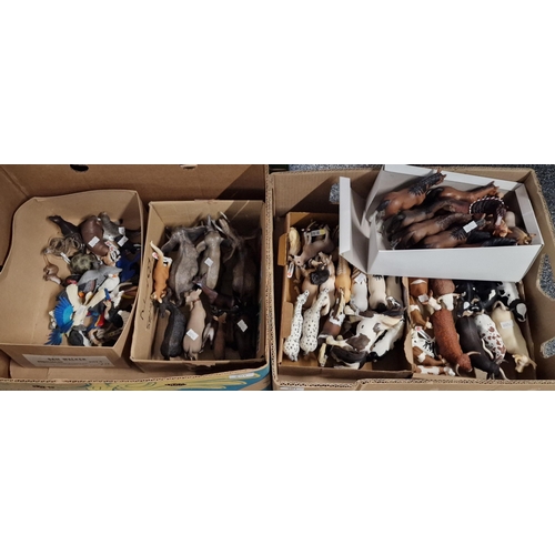 301 - Two boxes comprising large collections of Schleich German animals, various to include: cows, bulls, ... 