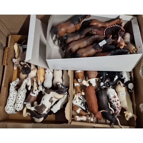 301 - Two boxes comprising large collections of Schleich German animals, various to include: cows, bulls, ... 