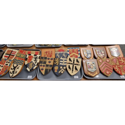 313 - An interesting and decorative collection of Welsh wooden armorials including: county badges, two Wel... 