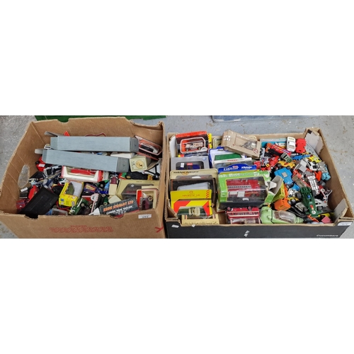 375 - Two boxes of playworn and other diecast model vehicles in original boxes to include: Dinky, Promotio... 