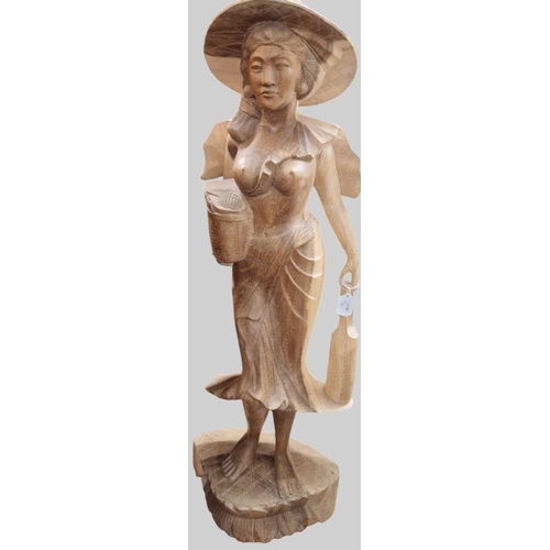 65A - Balinese carved hardwood semi-nude figurine of a lady at work. 103cm high approx.  (B.P. 21% + VAT)