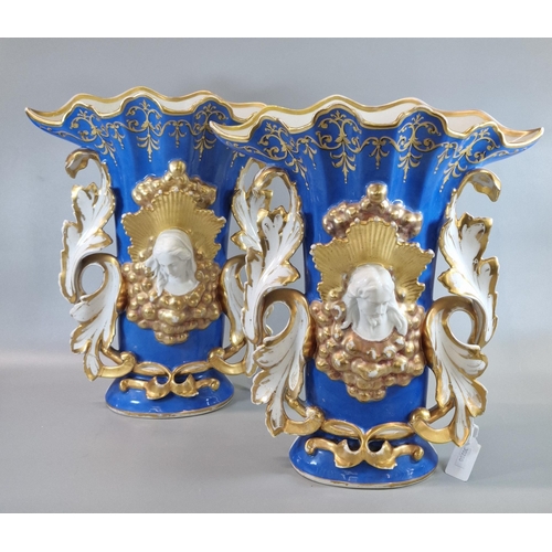 11 - Pair of late 19th / early 20th century Continental porcelain vases, on a blue ground in Rococo style... 