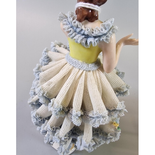 13 - Three Continental porcelain figurines of ballet dancers with encrusted dresses and flowers (3) The t... 