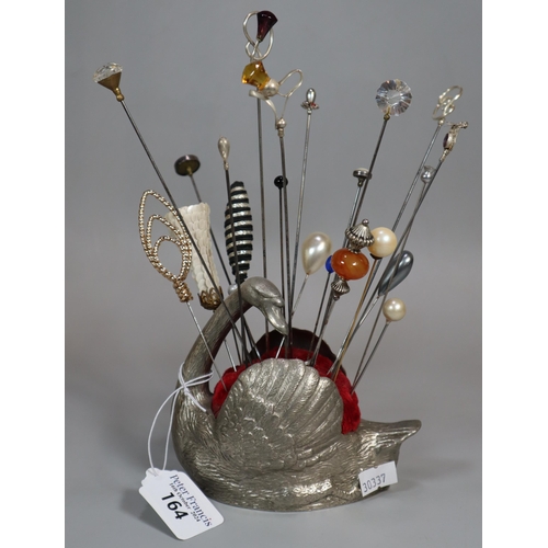 164 - Novelty silver-plated pin cushion in the form of a swan with a collection of hat pins, some silver a... 