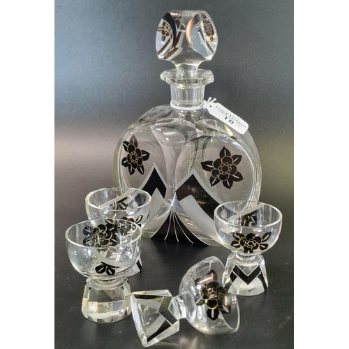 18 - In the style of Karl Palda, an Art Deco decanter set comprising decanter and stopper and four shot o... 