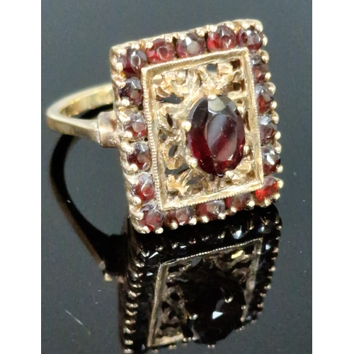 187 - 9ct gold and garnet dress ring. 5.9g approx. Ring size L 1/2. (B.P. 21% + VAT)