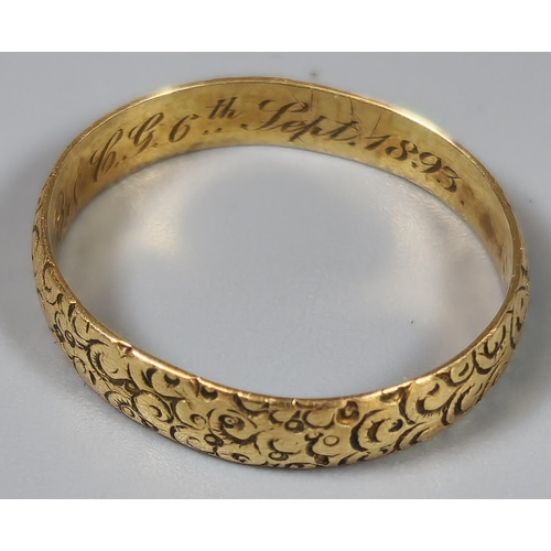 192 - 18ct gold engraved wedding band. 1.8g approx. Ring size L 1/2. (B.P. 21% + VAT)