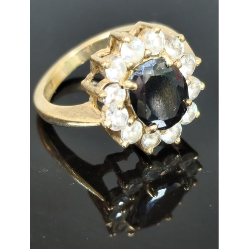 193 - 9ct gold clear and blue stone cluster ring. 5.5g approx. Ring size M. (B.P. 21% + VAT)