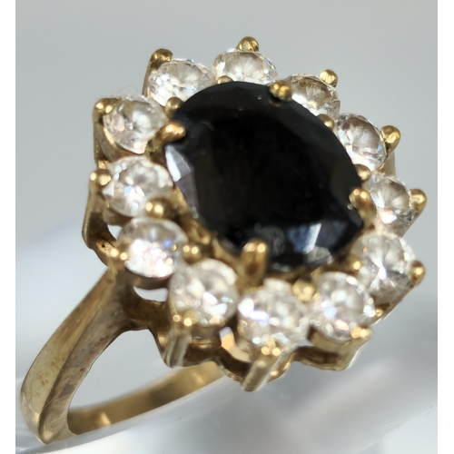 193 - 9ct gold clear and blue stone cluster ring. 5.5g approx. Ring size M. (B.P. 21% + VAT)