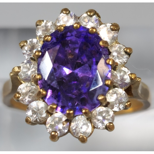 199 - 9ct gold purple and clear stone cluster ring. 4.3g approx. Ring size L 1/2. (B.P. 21% + VAT)