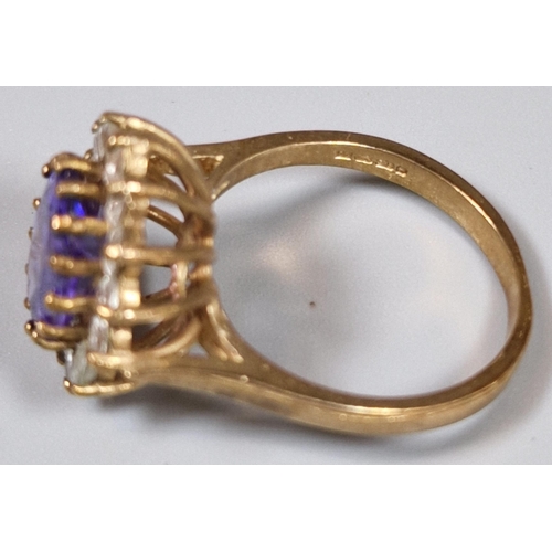 199 - 9ct gold purple and clear stone cluster ring. 4.3g approx. Ring size L 1/2. (B.P. 21% + VAT)