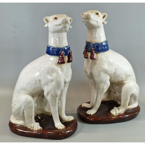 2 - Pair of probably Italian ceramic seated fireside whippets/lurcher dogs. Unmarked. Both approx. 35cm ... 