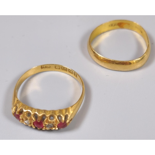 200 - Yellow metal wedding band. 1.8g approx. Ring size J 1/2. Together with an 18ct diamond and ruby ring... 