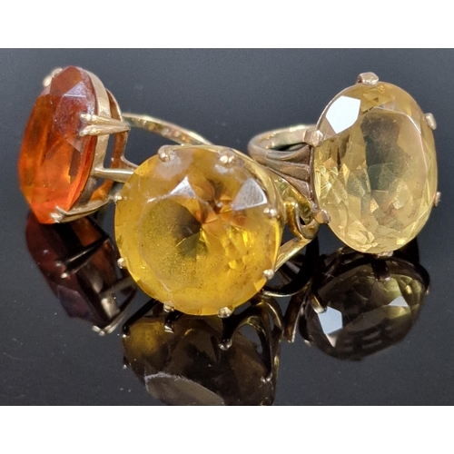 203 - Three 9ct gold dress rings inset with orange and yellow stones. 20g approx. Ring sizes P 1/2, M 1/2 ... 