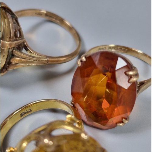 203 - Three 9ct gold dress rings inset with orange and yellow stones. 20g approx. Ring sizes P 1/2, M 1/2 ... 