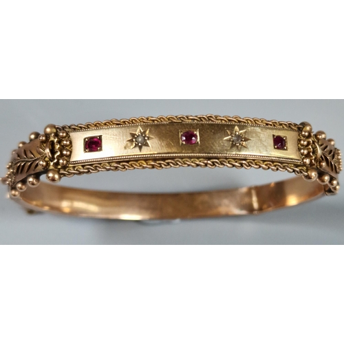 210 - 9ct rose gold diamond and ruby ladies' bangle. 11g approx. (B.P. 21% + VAT)