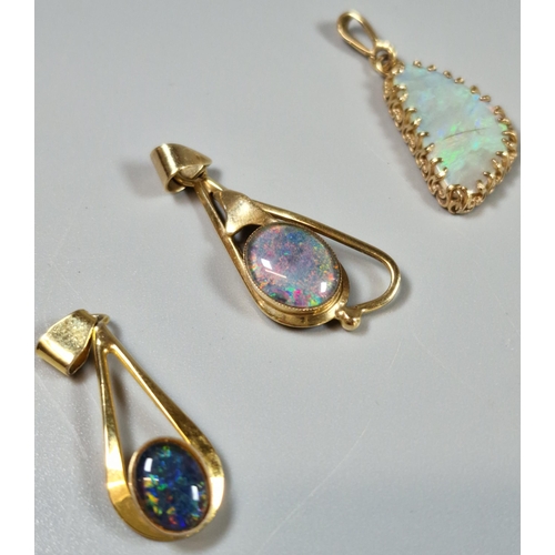 214 - Three 9ct gold and opal pendants. (3) (B.P. 21% + VAT)