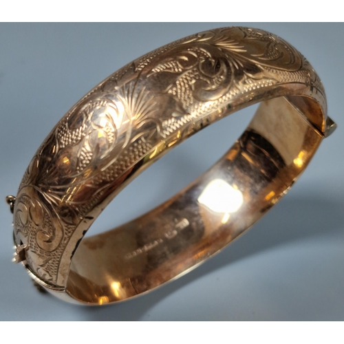 223 - 9ct rose gold engraved bangle. 26g approx. (B.P. 21% + VAT)