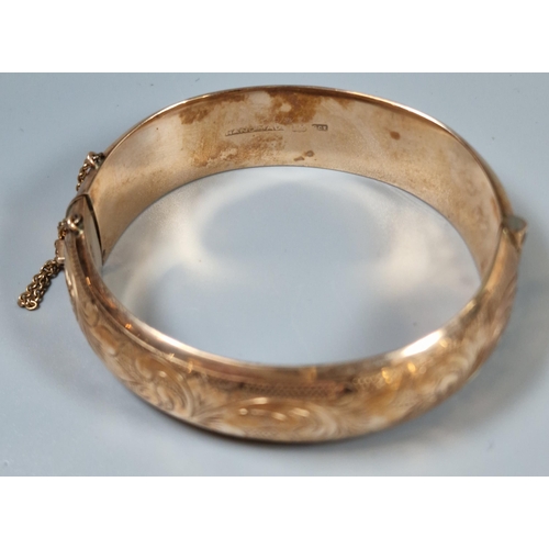 223 - 9ct rose gold engraved bangle. 26g approx. (B.P. 21% + VAT)