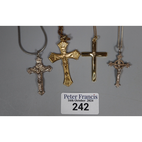 242 - A collection of silver and silver gilt crucifix pendants and chains. (B.P. 21% + VAT)