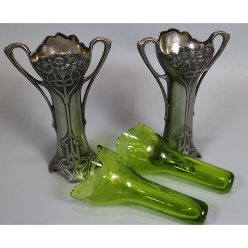 260 - A pair of Art Nouveau pewter Epergne two-handled vases with green glass liners. Unmarked. Height app... 