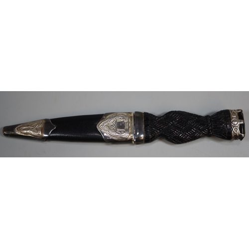 262 - Edinburgh silver-mounted Sgian Dubh with basket weave decorated grip and crown finial with gem set s... 