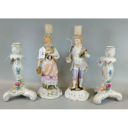 39 - Pair of German porcelain florally encrusted candlesticks together with a German porcelain figural ca... 