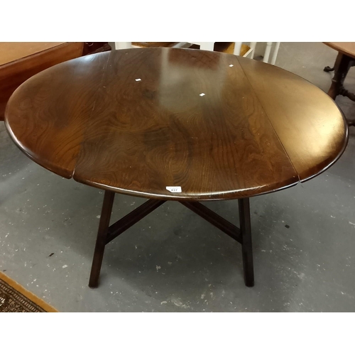 437 - Mid-century elm Ercol drop-leaf table on X frame supports. (B.P. 21% + VAT)