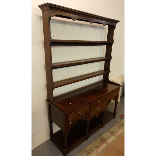 442 - Reproduction Welsh oak rack backed dresser with Gothic style decoration, three shelves to the open r... 