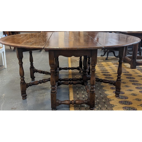 448 - Titchmarsh & Goodwin, 17th century style oak double gateleg table with two leaves to form an oval, r... 