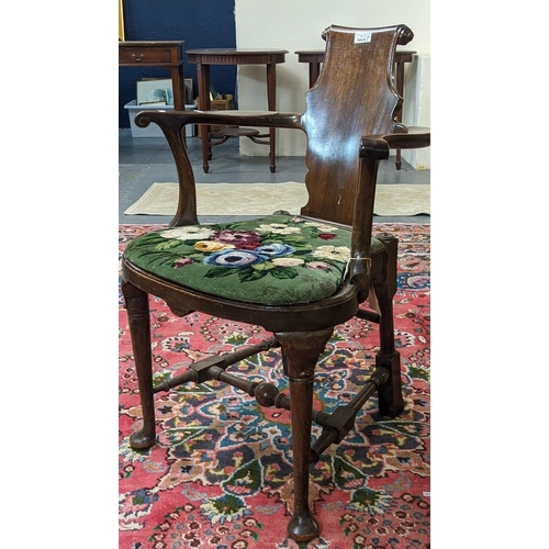 449A - 18th century style mahogany scrolled splat back elbow chair with bow fronted cane seat on moulded ca... 