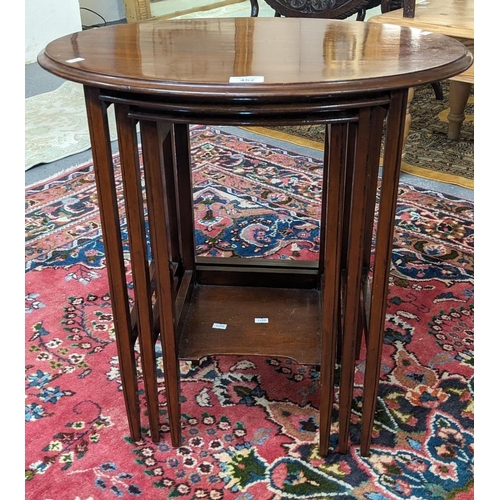 452 - Edwardian mahogany nest of three oval tables. (B.P. 21% + VAT)