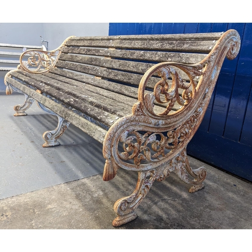 455 - Heavy cast iron scrolled foliate design garden bench with centre cast iron support and wooden slats.... 