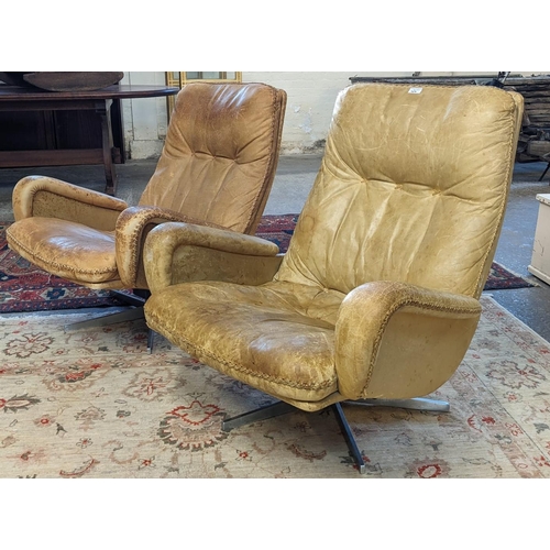 464 - Pair of 1960's or 70's leather designer pedestal, 'James Bond' chairs, probably by De Sede. (Sold as... 