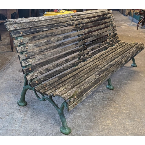 465 - Slatted wooden garden bench with three part cast iron underframe. 182cm wide approx. (B.P. 21% + VAT... 