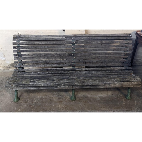 466 - Slatted wooden garden bench with three part cast iron underframe. 182cm wide approx. (B.P. 21% + VAT... 