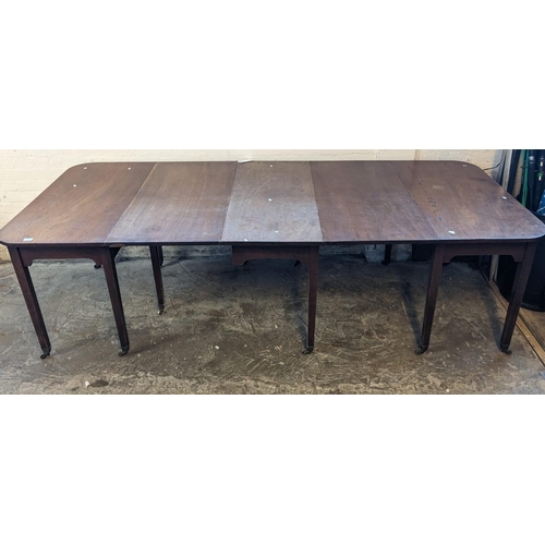 467 - 19th century three section extending dining table, the centre section with two drop leaves on gate a... 