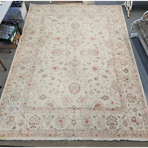 486 - Large Middle Eastern design cream ground floral and foliate carpet. 342 x 246cm approx. Together wit... 