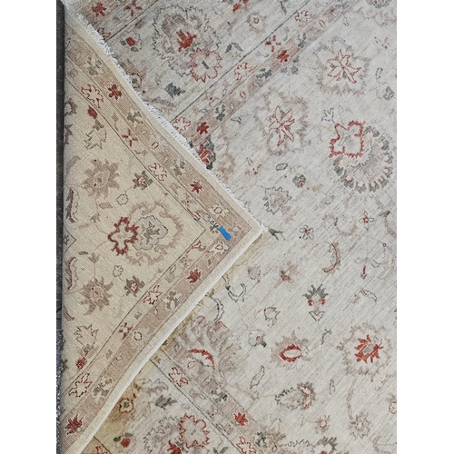 486 - Large Middle Eastern design cream ground floral and foliate carpet. 342 x 246cm approx. Together wit... 